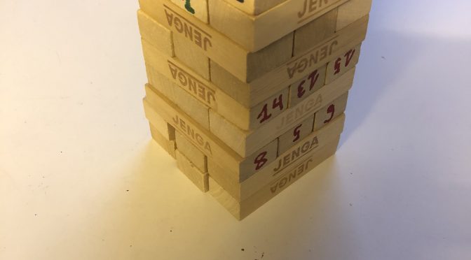 A tower of blocks with written numbers in different colors